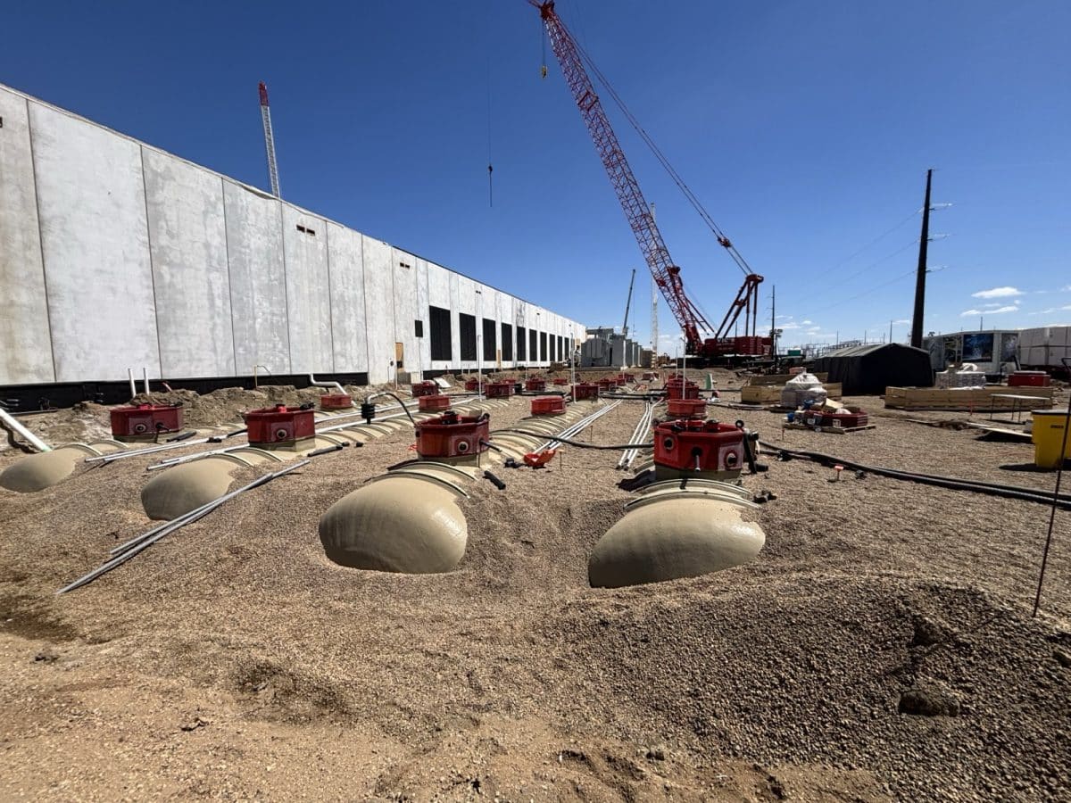 Fuel tanks being backfilled with containment sumps and risers installed at a data center site